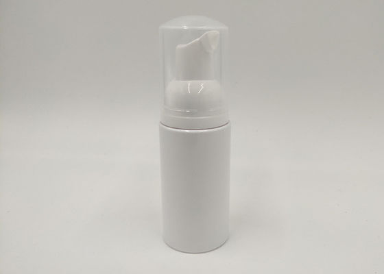 O cosmético plástico branco engarrafa a garrafa líquida da espuma